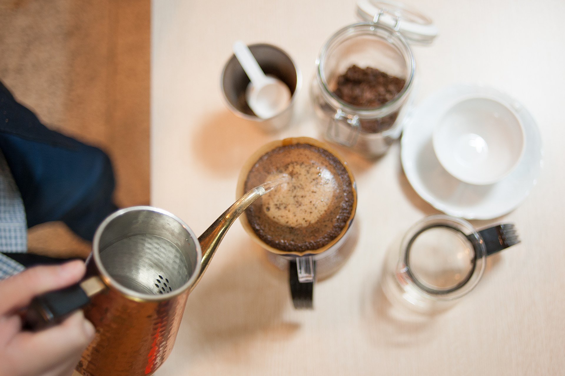 A pour-over coffee being brewed into a cup